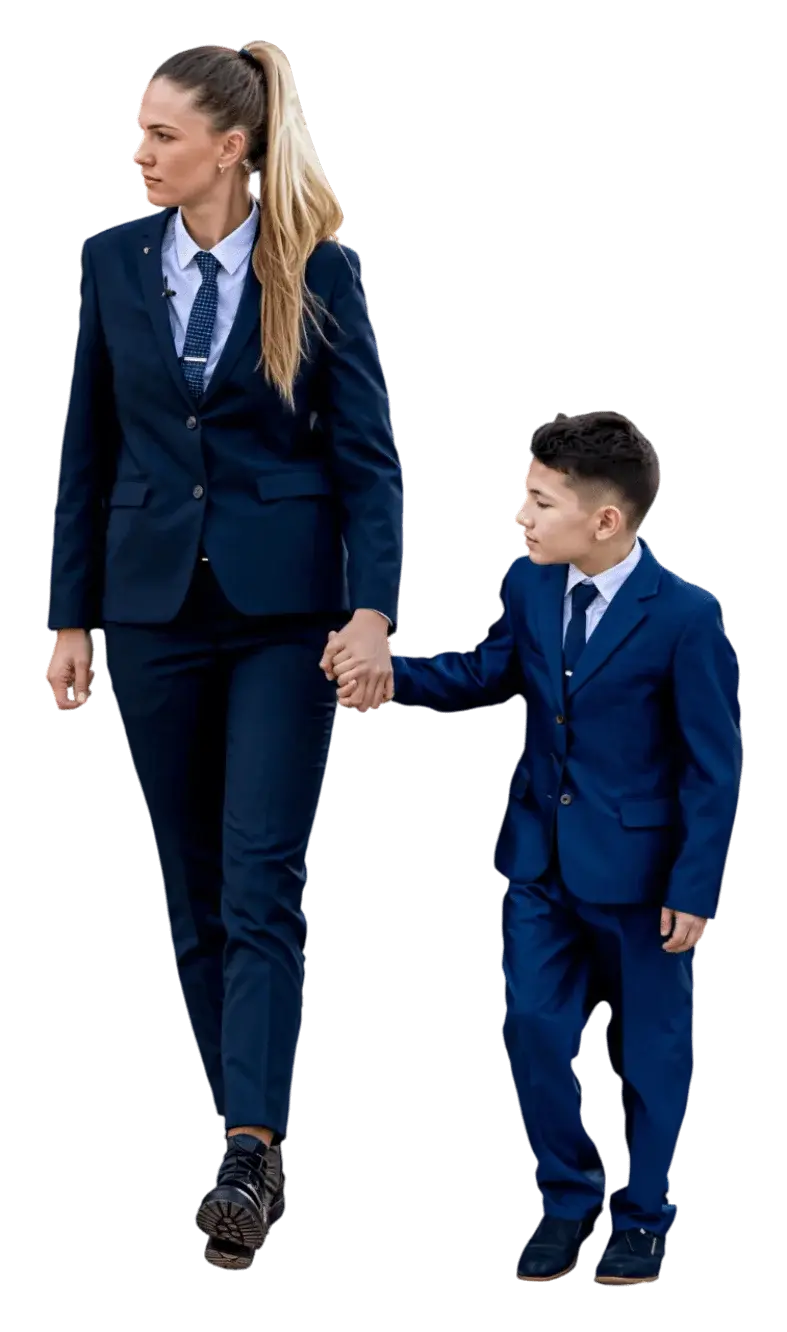 Woman in a suit walking with a child