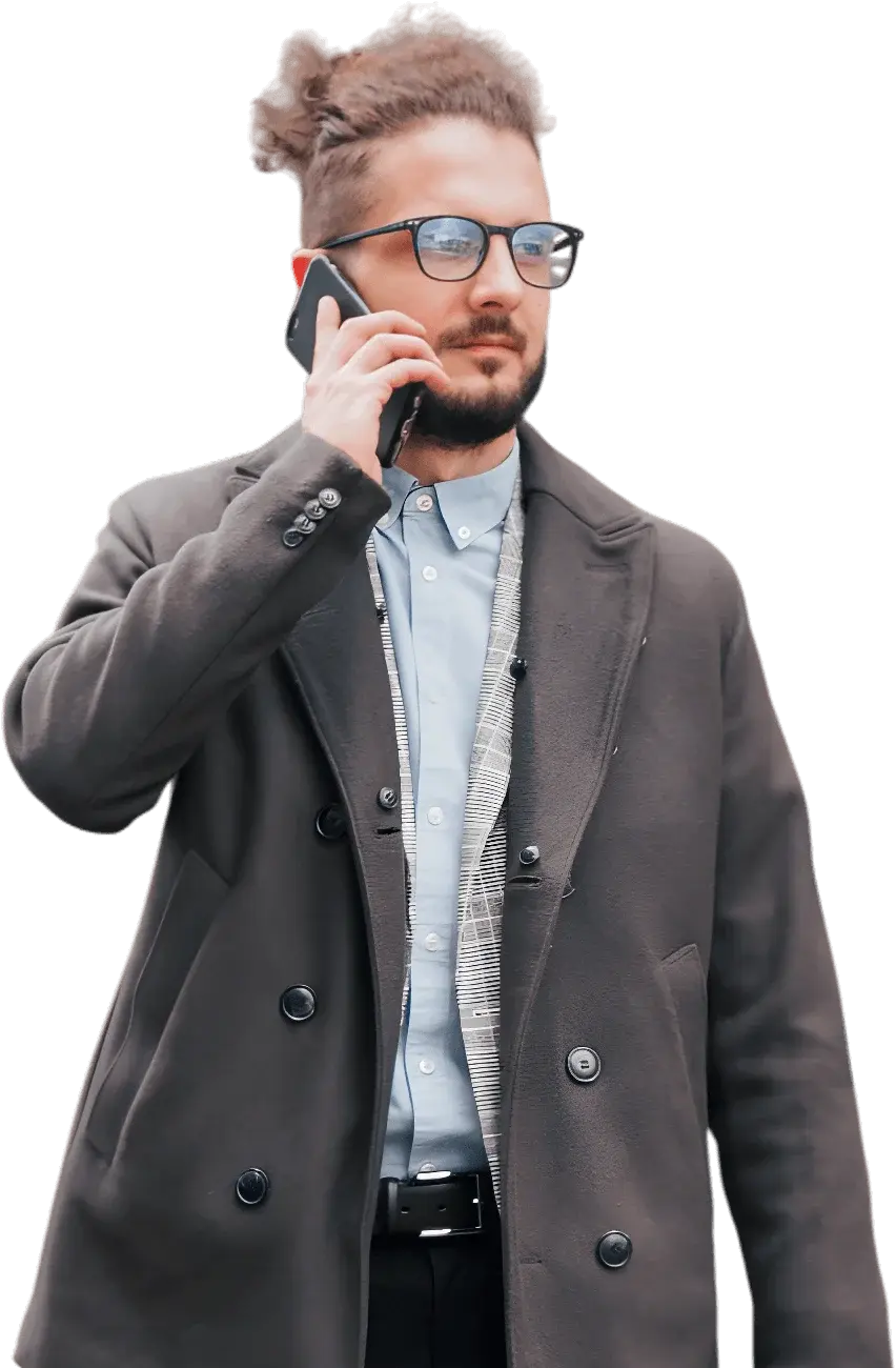 Man in a jacket using a phone