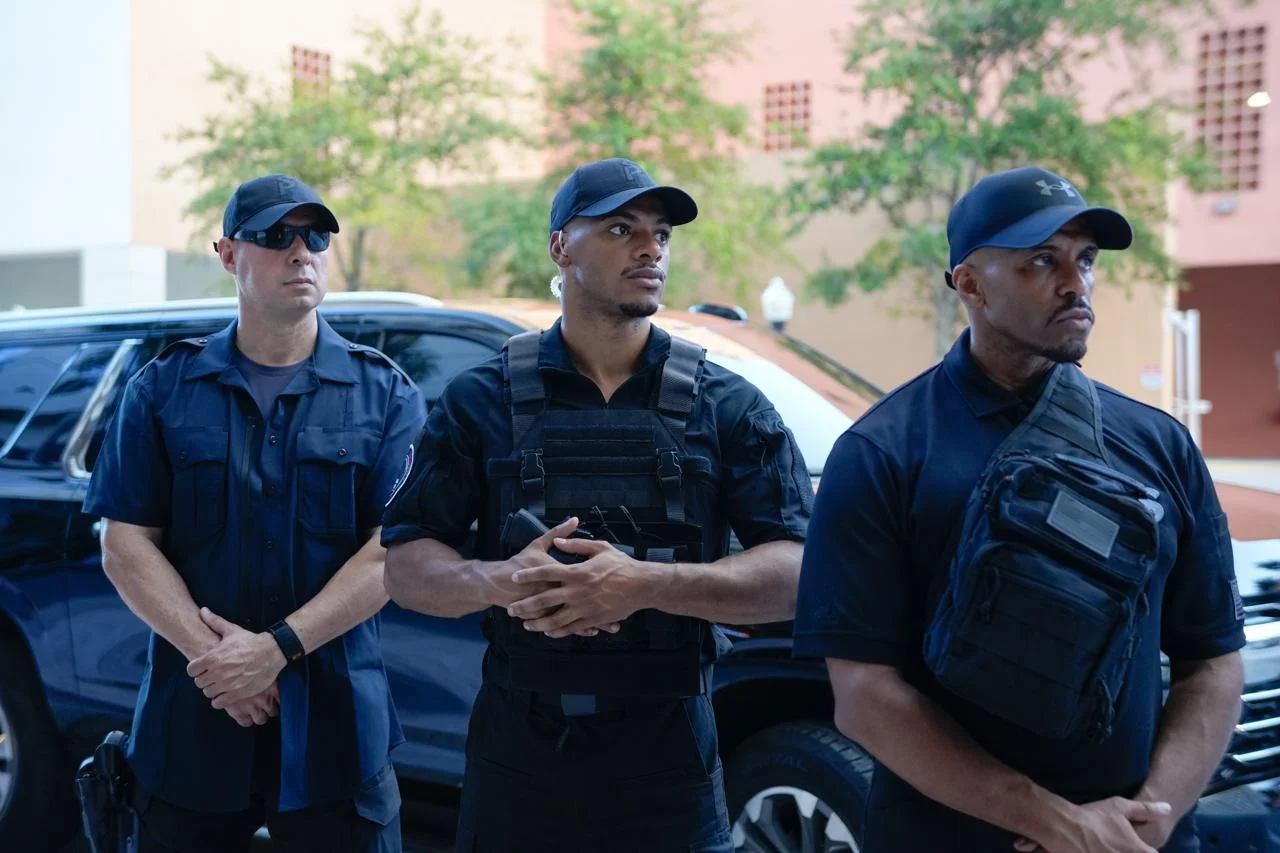 Three uniformed security guards
