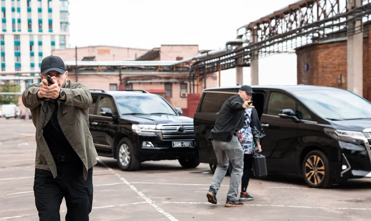Security team near parked vehicles